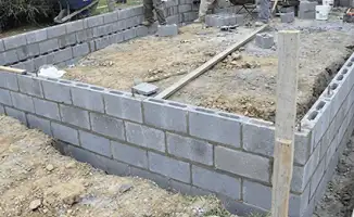 Professionals building a foundation with blocks in Riverside, CA