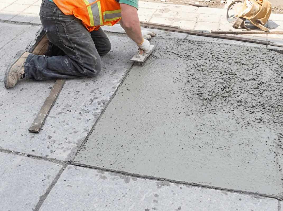 Professional repairing a concrete floor in Riverside, CA