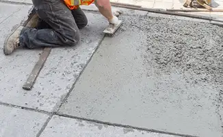 Professional repairing a concrete floor in Riverside, CA